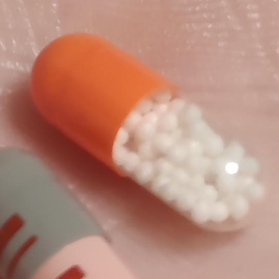 orange/translucent capsule