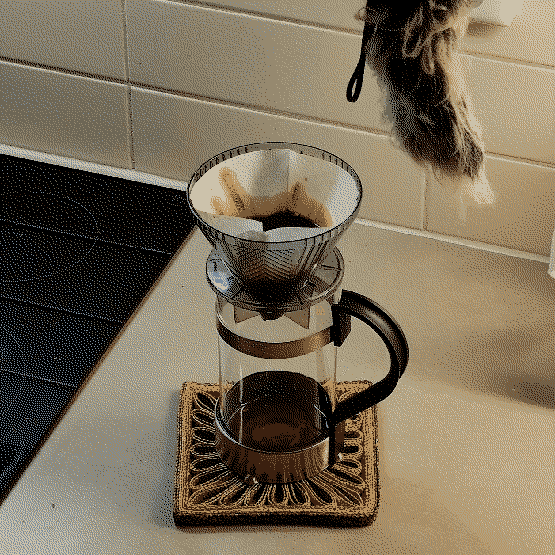 photo of the butter being filtered through a coffee filter