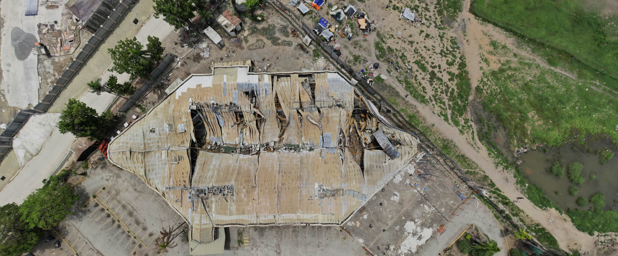 aerial view of a collapsed building with an interesting rhomb ish shape
