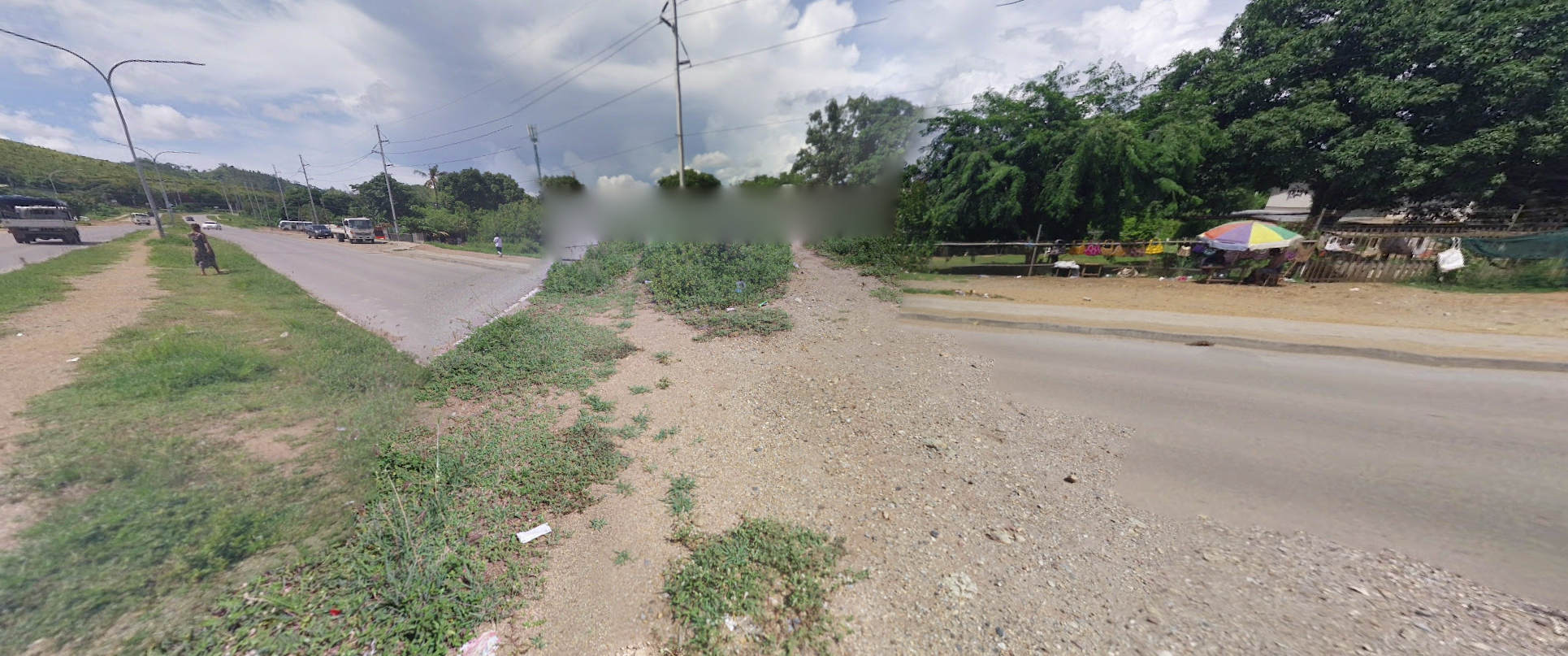 photo of a road, but another road is put on top. the perspective is different. it looks weird