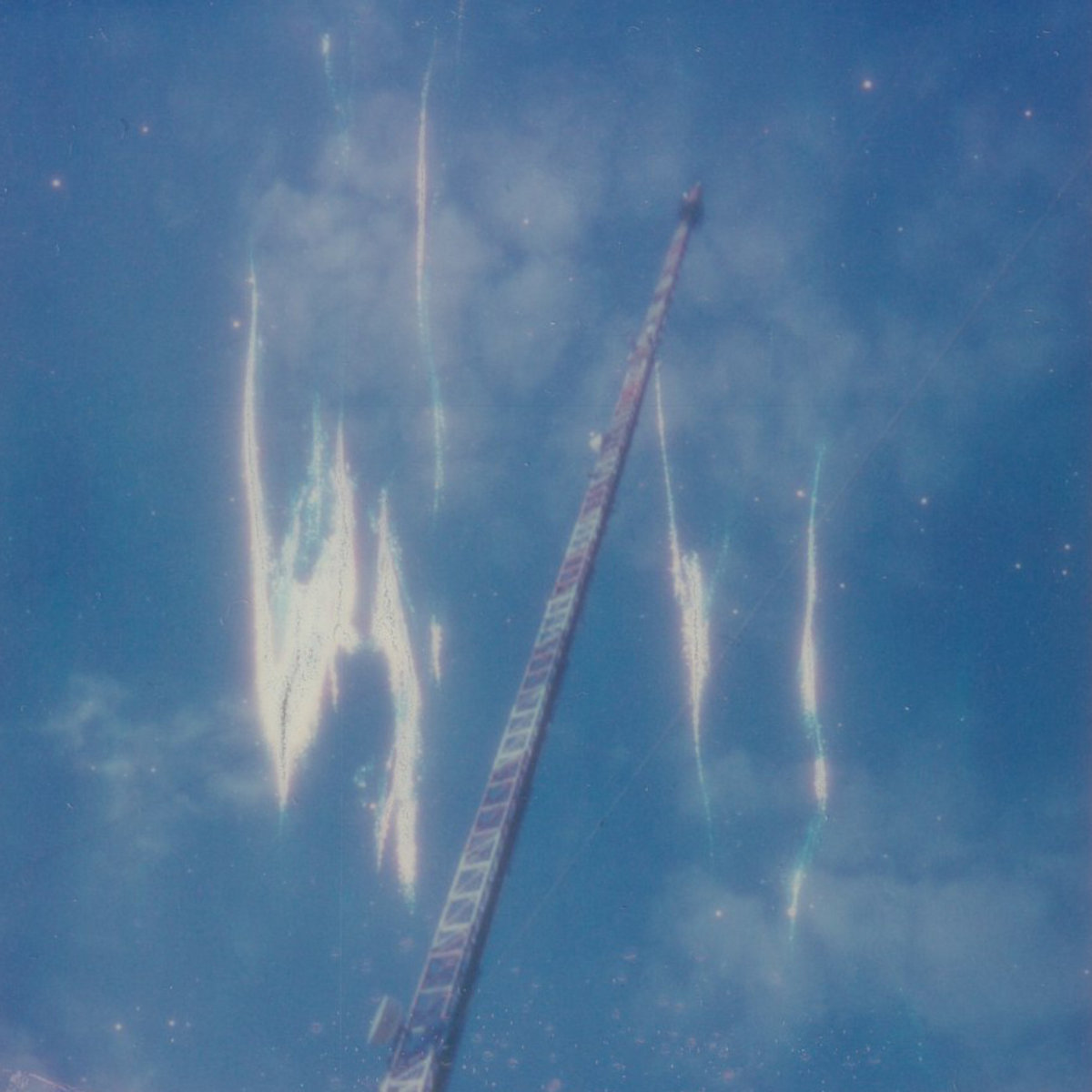 Album cover. Cropped polaroid 600 photo of a radio tower, with some artifacts (from the camera) what makes it look like electricity or something in the air around it